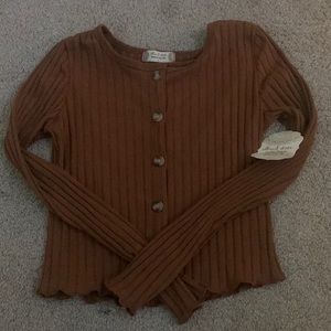 This is a tight long sleeved top.It is brown and is in size small.
